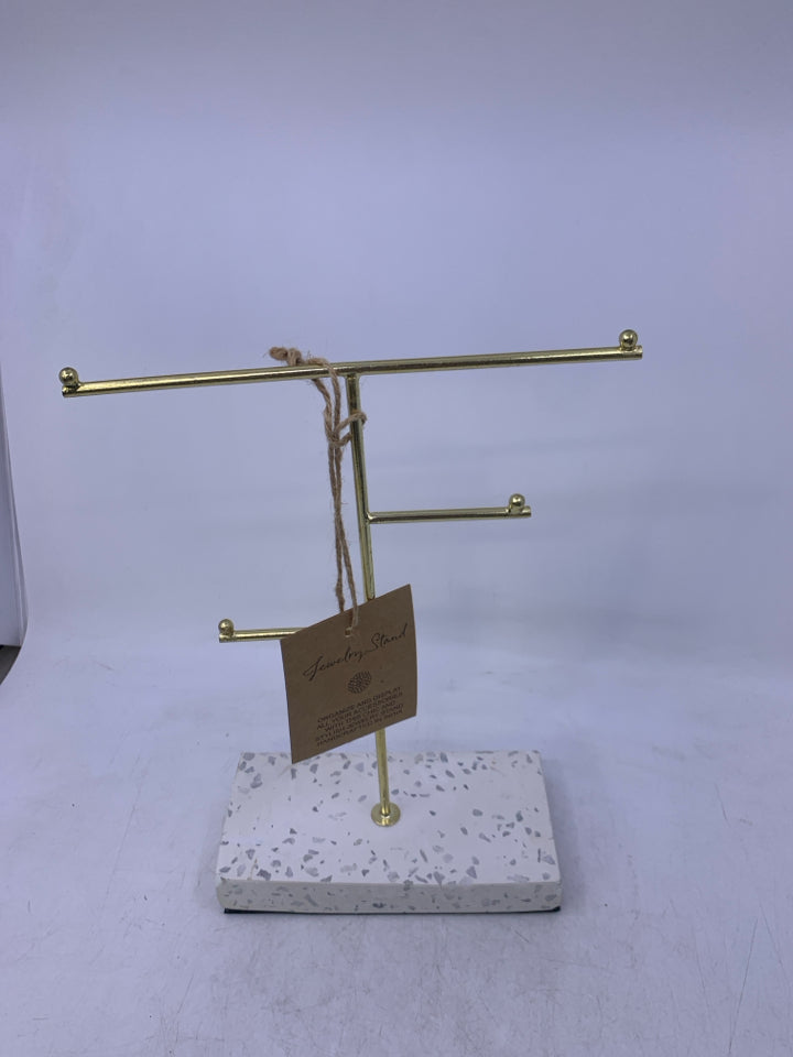 WHITE BASE W/ GOLD METAL JEWELRY STAND.