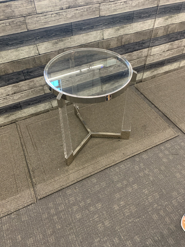 SILVER AND GLASS CIRCLE END TABLE W/ 3 LEGS.