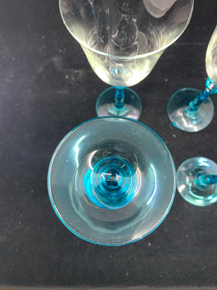 4 LIGHT BLUE STEM WINE GLASSES W/ SLIGHT FLARE.