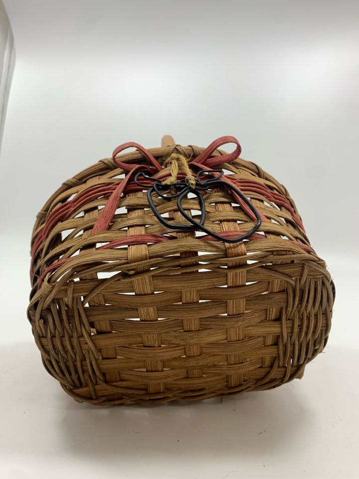 OVAL BASKET W/PINK STRIPES AND METAL APPLES.