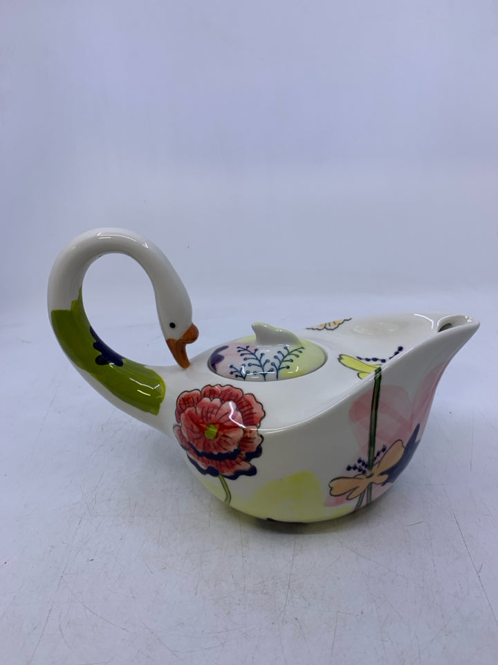 SWAN SHAPED W/ COLORFUL FLOWERS.