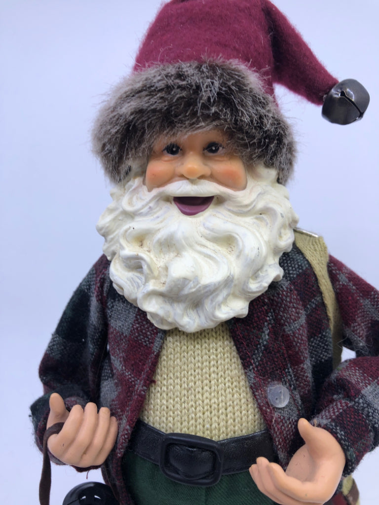 RESIN SANTA W/ PLAID FLANNEL HOLDING LANTERN.
