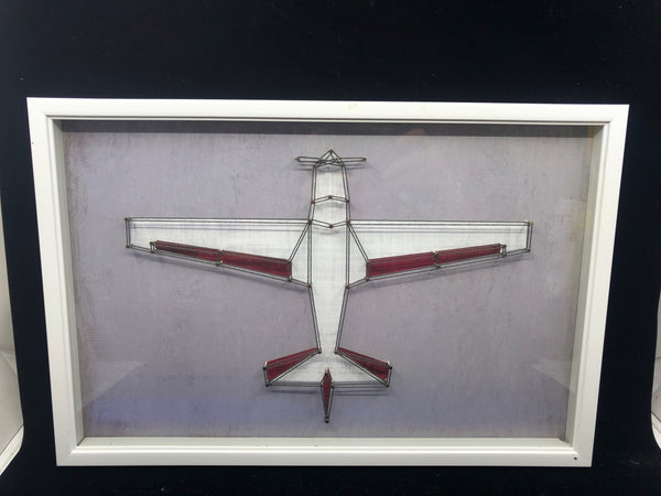 AIRPLANE STRING ART IN WHITE FRAME WALL HANGING.