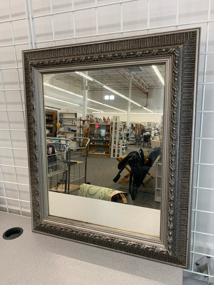 SILVER FRAMED WALL MIRROR.