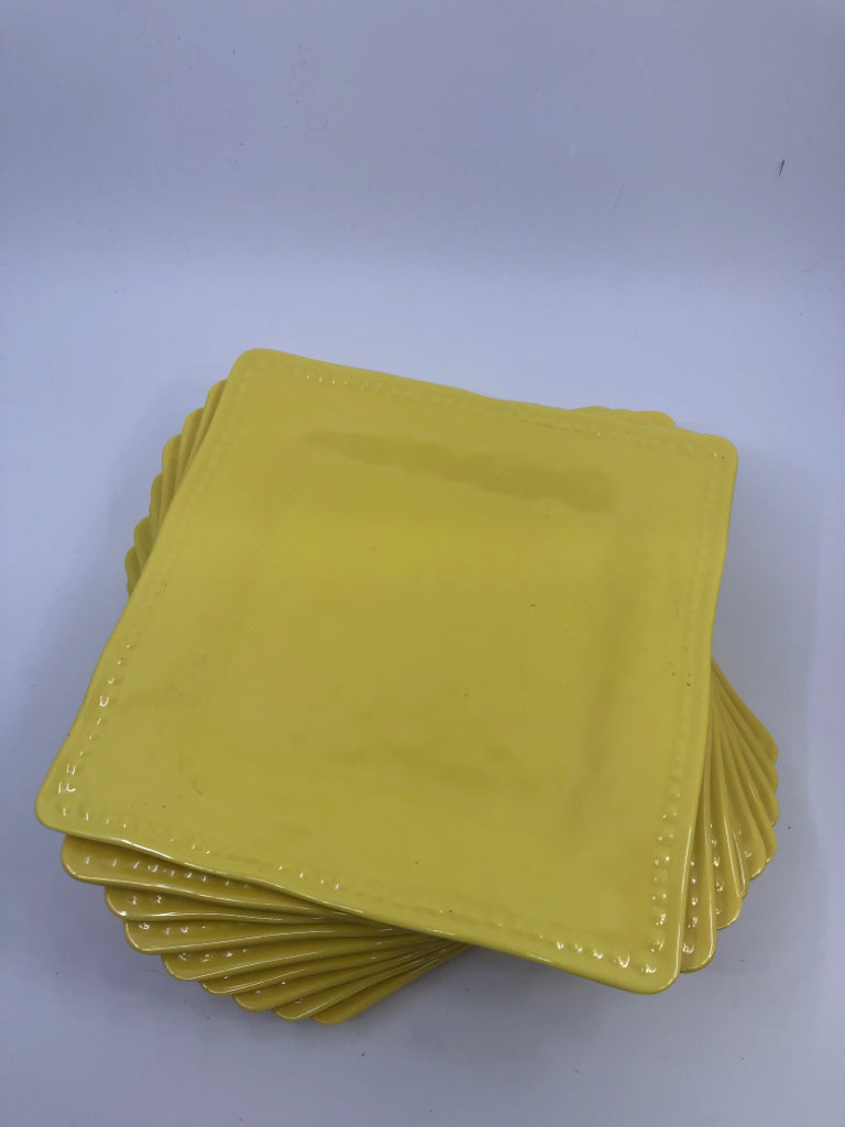 9 YELLOW SQUARE PLASTIC PLATES.
