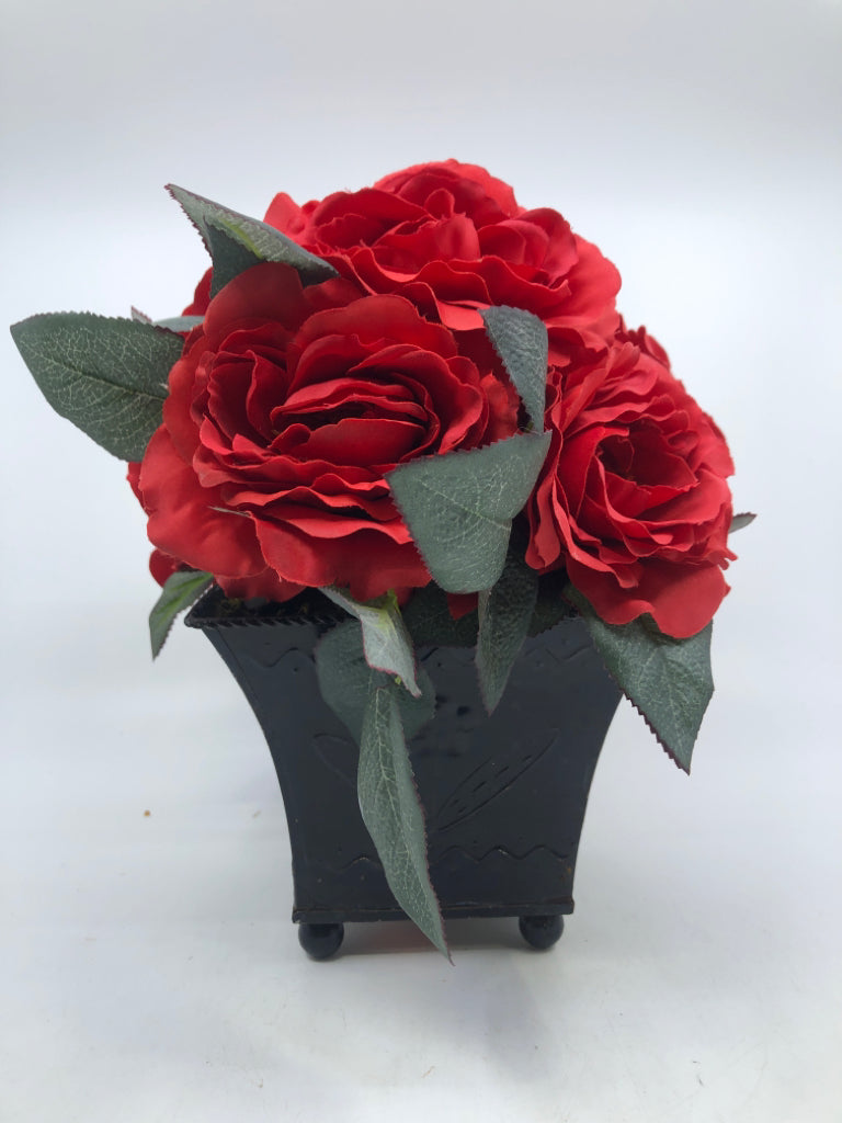 FOOTED BROWN METAL PLANTER W/ FAUX RED FLOWER BOUQUET.