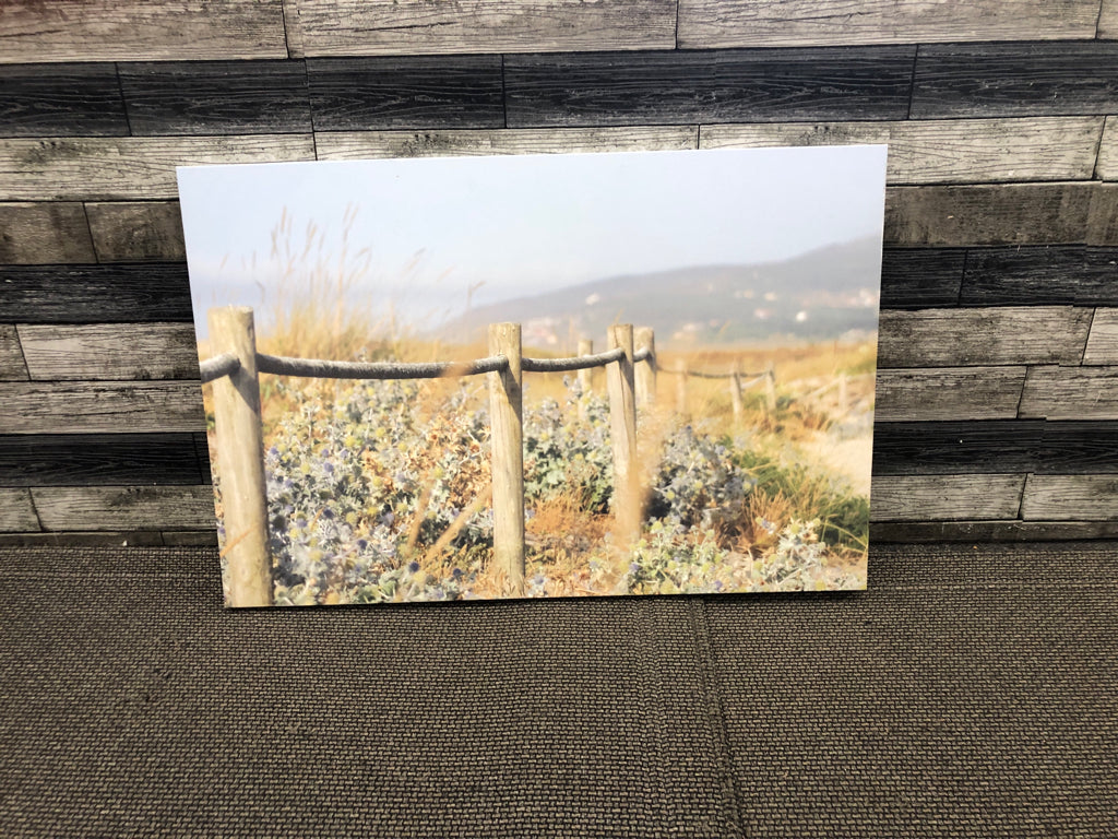 PURPLE FLORAL AND FENCE CANVAS WALL ART.