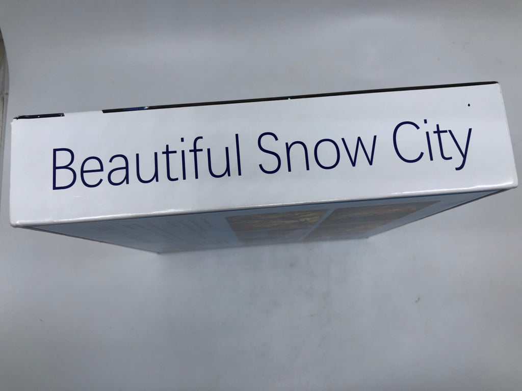 NIB SNOWY CITY PUZZLE.