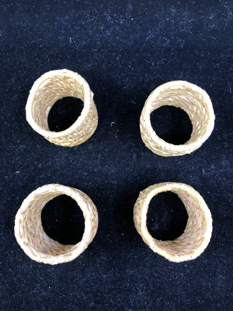 4 WICKER NAPKIN RINGS.