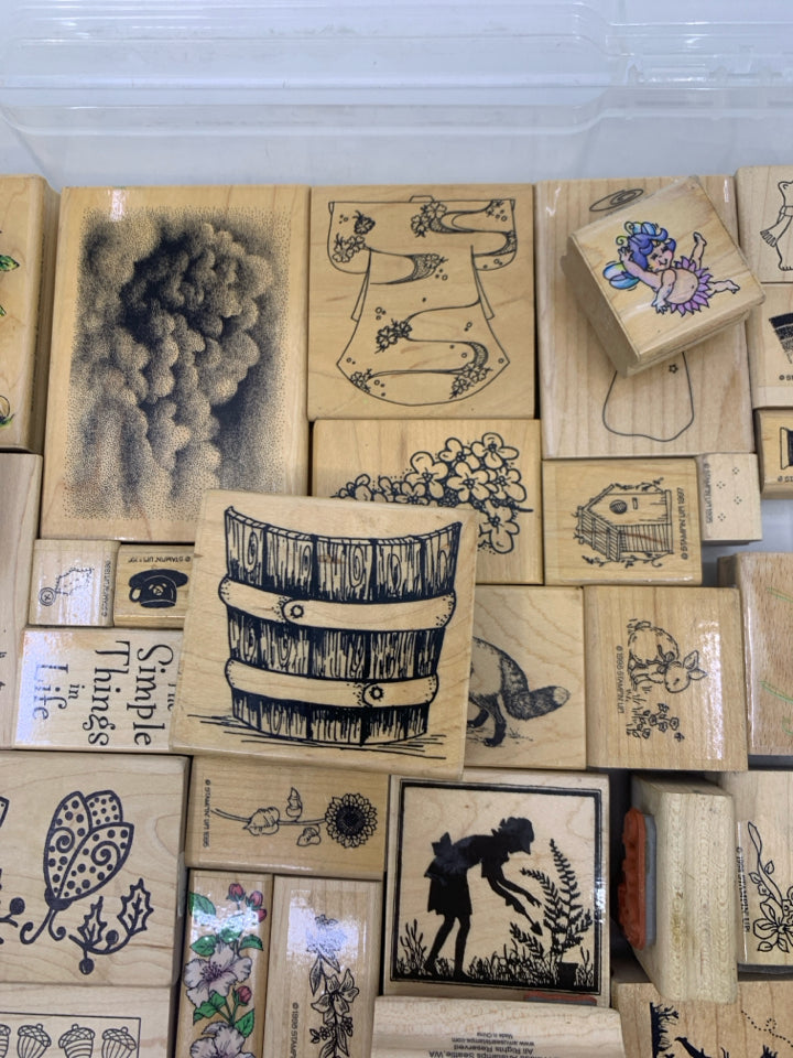 35 ASSORTED STAMPS IN CLEAR PLASTIC CASE.