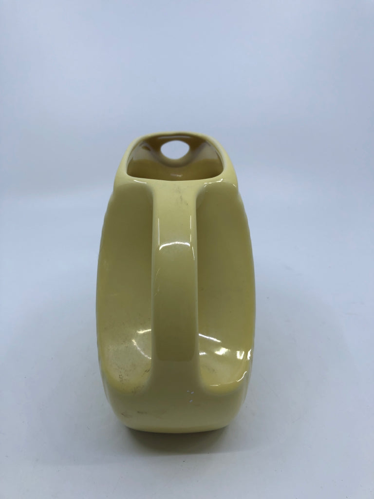 YELLOW FIESTA WARE DISC PITCHER W/HANDLE.