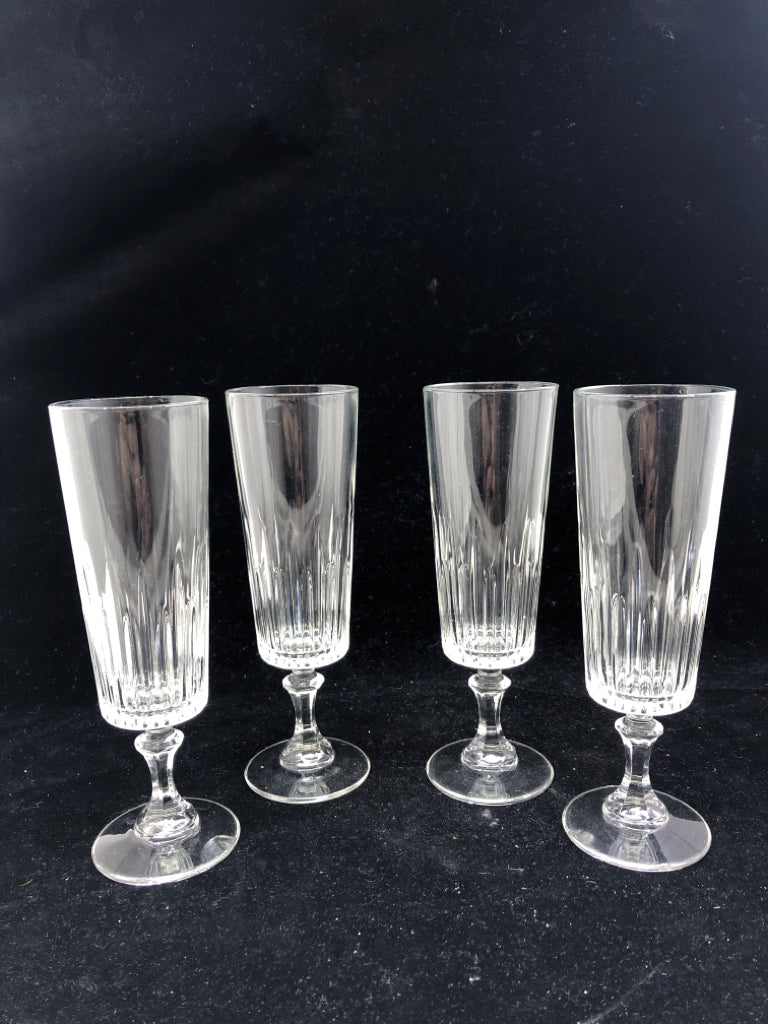 4 FOOTED CHAMPAGNE GLASS CUT GLASS BOTTOM.