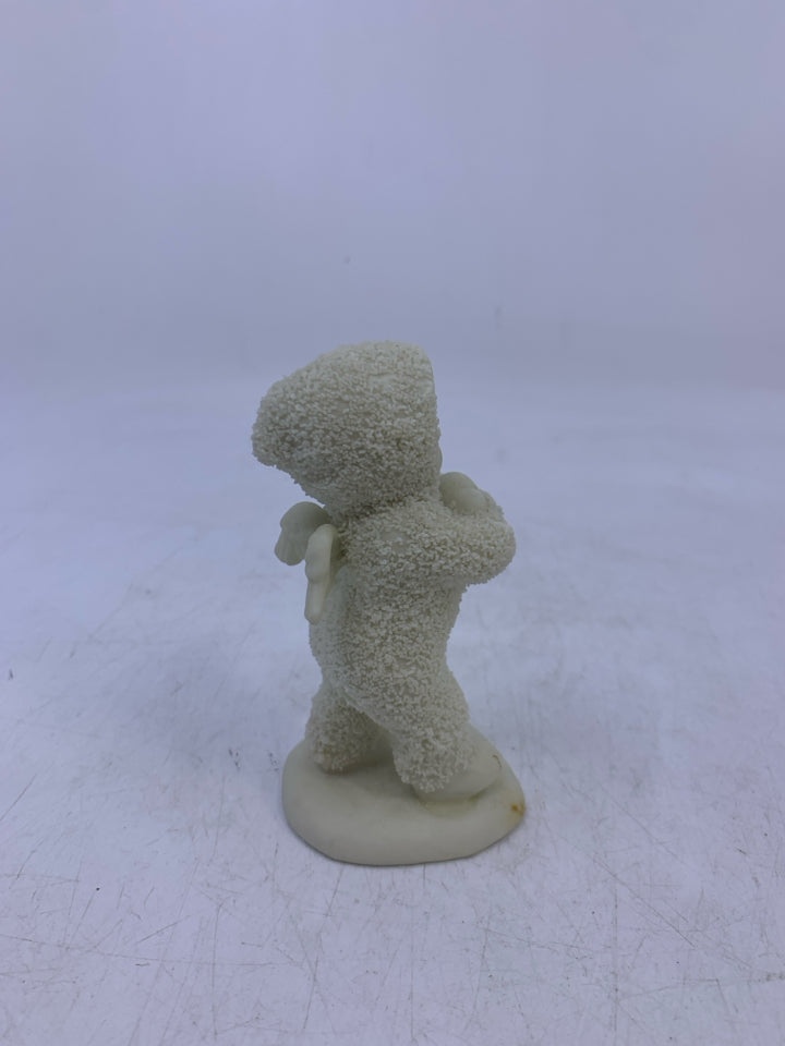 SNOW BABY HOLDING 2 SNOWBALLS WALKING.