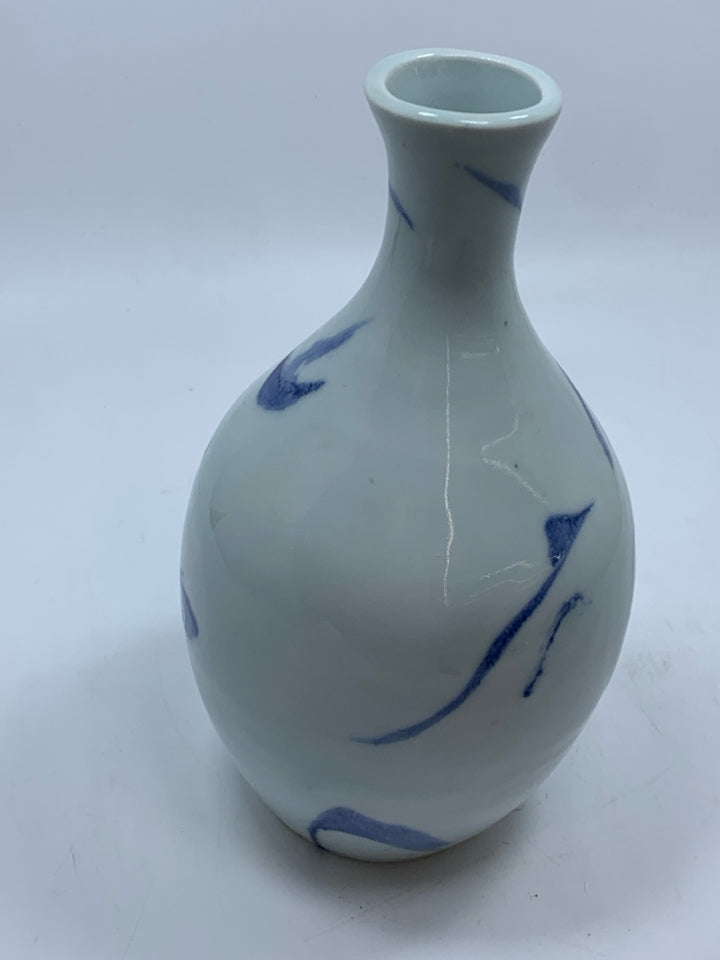 WHITE POTTERY VASE W/BLUE DESIGNS.