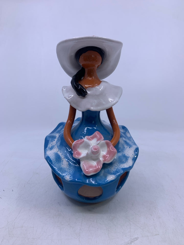 CLAY FACELESS WOMAN W/ BLUE DRESS W/ HOLES + WHITE HAT.