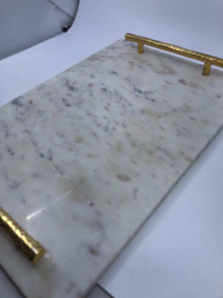 MARBLE, GOLD HANDLE CUTTING BOARD.