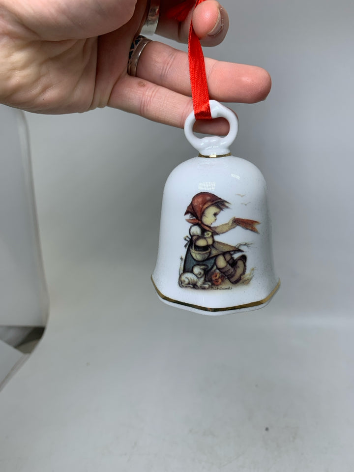 IN BOX HUMMEL GIRL SITTING WITH LAMB BELL ORNAMENT.