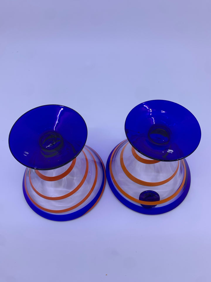 2 BLOWN GLASS FOOTED MARTINI GLASSES W/ COBALT BLUE W/ORANGE SWIRL.