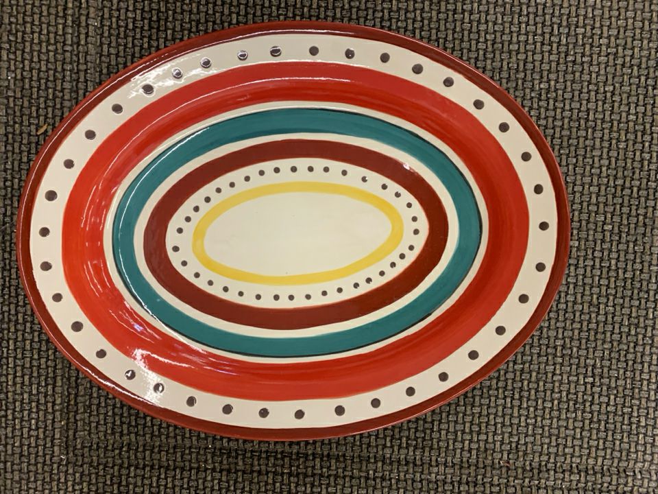 LARGE CERAMIC OVAL SERVING BOWL RED STRIPES/ BROWN POLKA DOTS.
