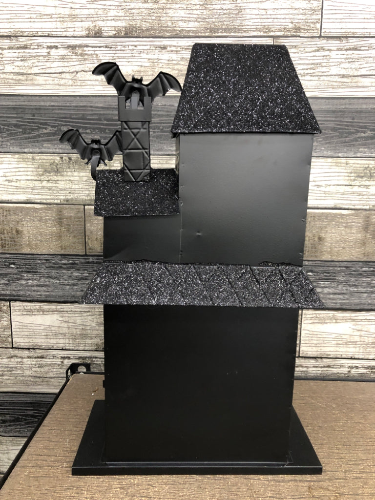 BLACK METAL AND GLITTER LED HAUNTED HOUSE.