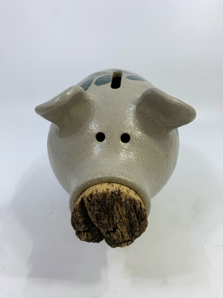 STONEWARE PIGGY BANK W/CORK SNOUT & PAINTED LEAVES.