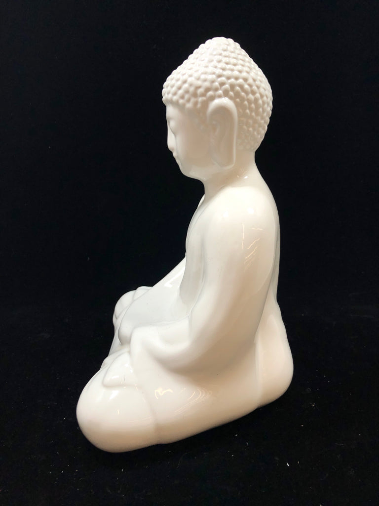 WHITE CERAMIC BUDDHA SCULPTURE.