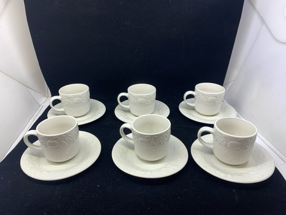 12 PC WHITE GIBSON EMBOSSED FRUIT TEACUPS AND SAUCERS.