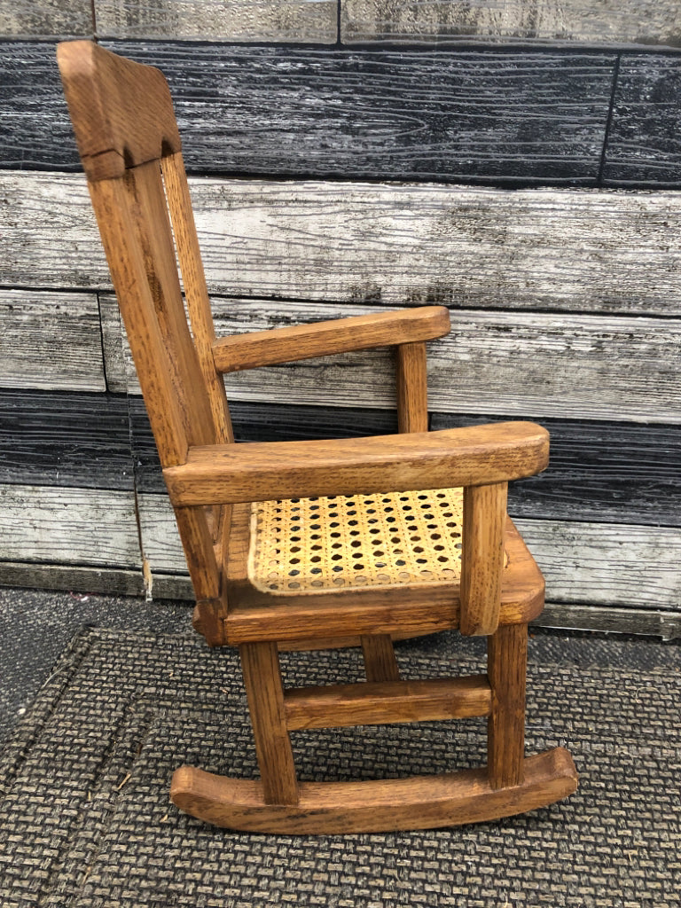 WOOD DOLL ROCKING CHAIR W/CANE SEAT.