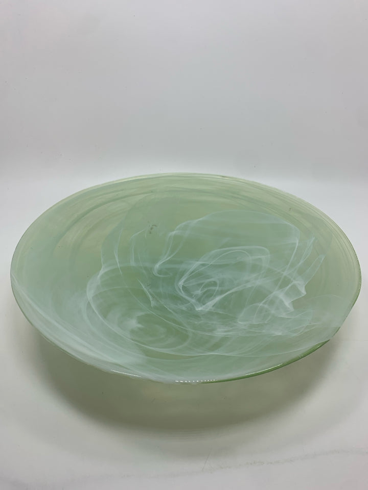 WHITE SWIRL IN GREEN GLASS BOWL.
