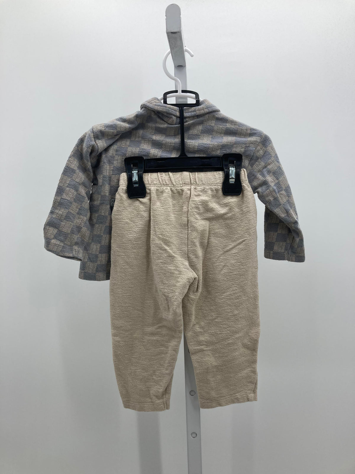 CHECKERED SHIRT AND TAN PANTS
