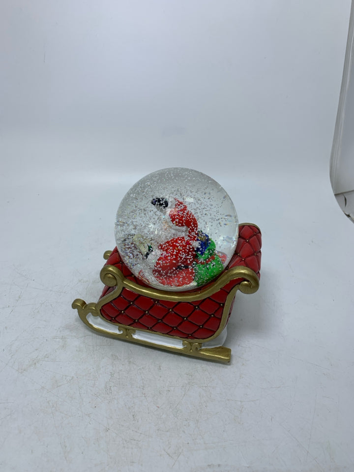 RESIN SLAY W/ SANTA READING LIST SNOW GLOBE.