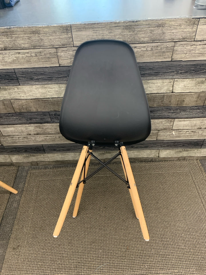 2 DARK GREY PLASTIC CHAIRS W/ WOOD LEGS.