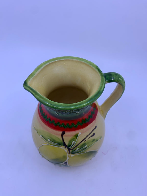 HAND PAINTED RED GREEN AND YELLOW PITCHER.