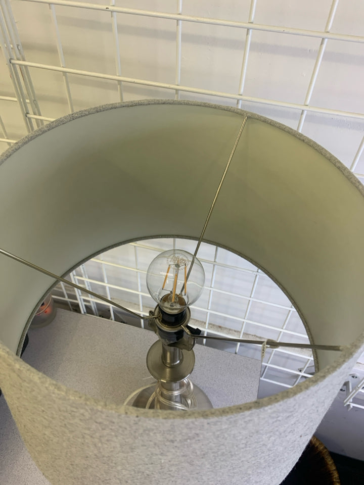 SILVER BASE LAMP W/GREY SHADE.