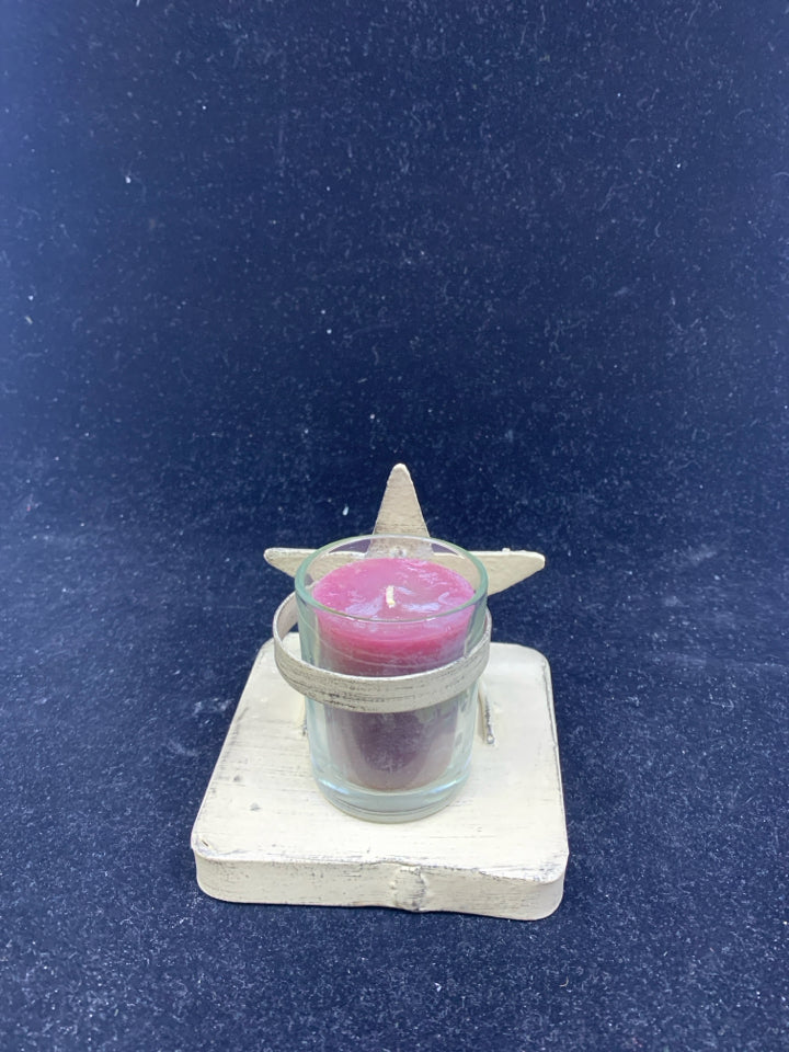 PRIMITIVE STAR ON BASE W/ CANDLE.
