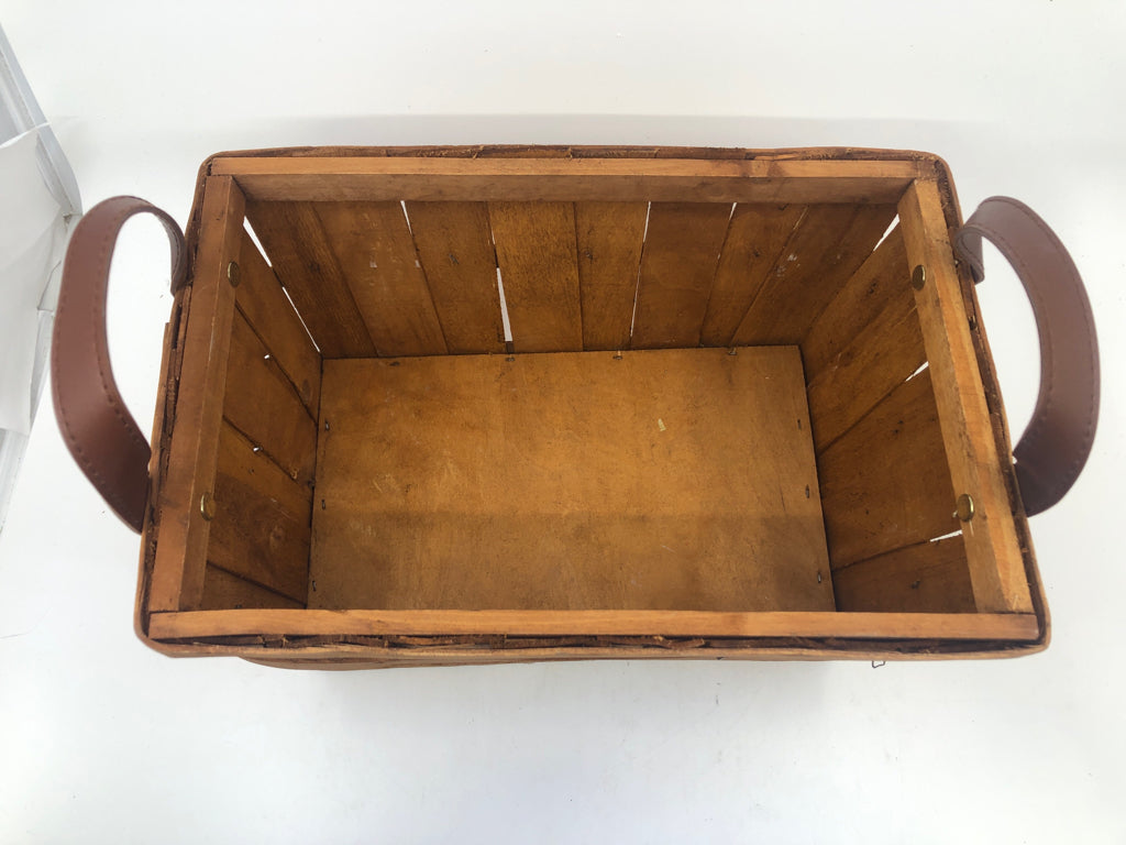 WOOD RECTANGLE BASKET W FAUX LEATHER HANDLES.