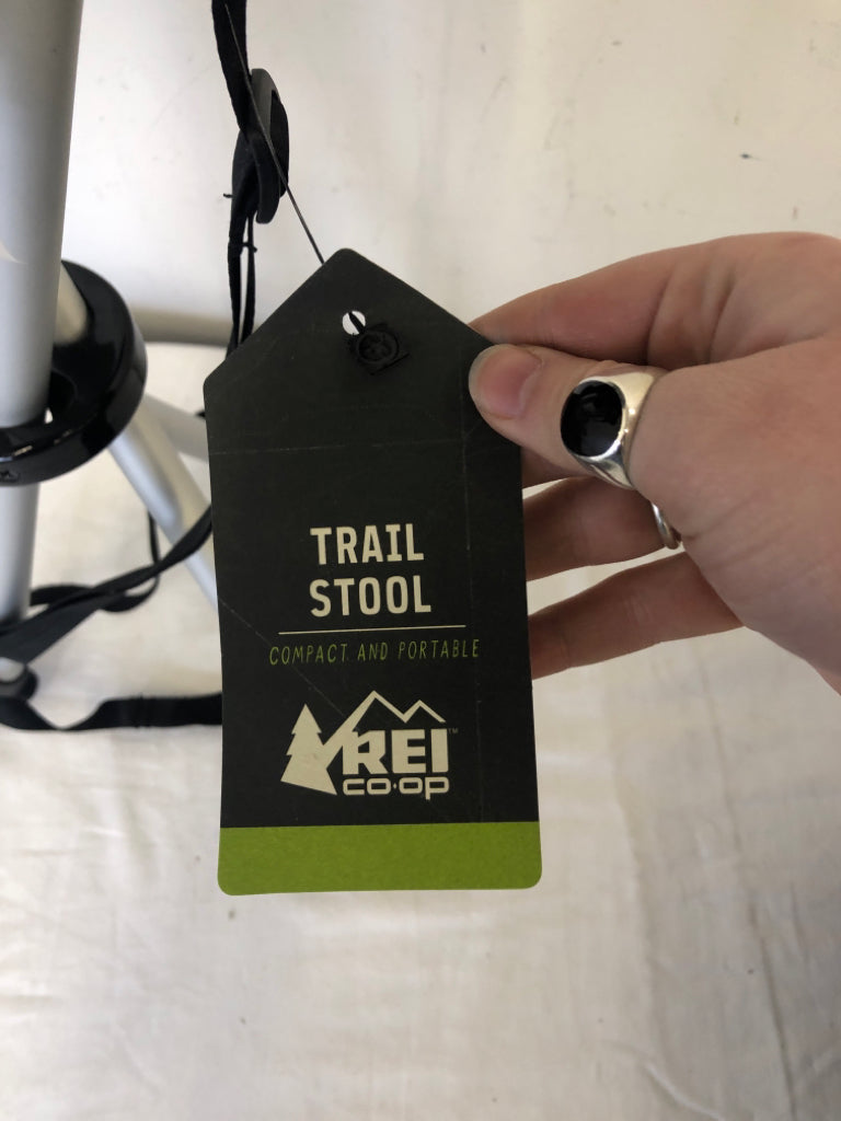 NIP REI FOLDING TRAIL STOOL.