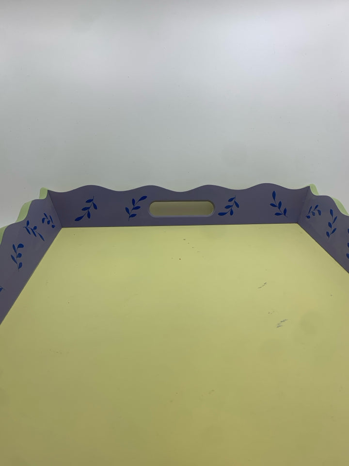 YELLOW WOOD TRAY W/BLUE PAINTED LEAVES AND WAVY EDGE.
