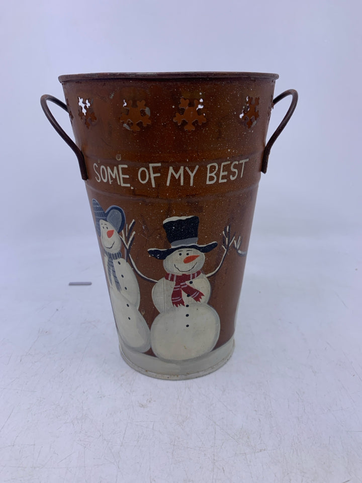 METAL BUCKET VASE W/ PRIMITIVE STYLE SNOWMAN W/ PIERCED SNOWFLAKES.