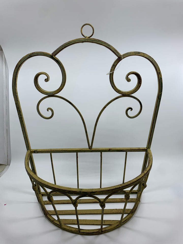 DISTRESSED YELLOW METAL SCROLL WALL POCKET.