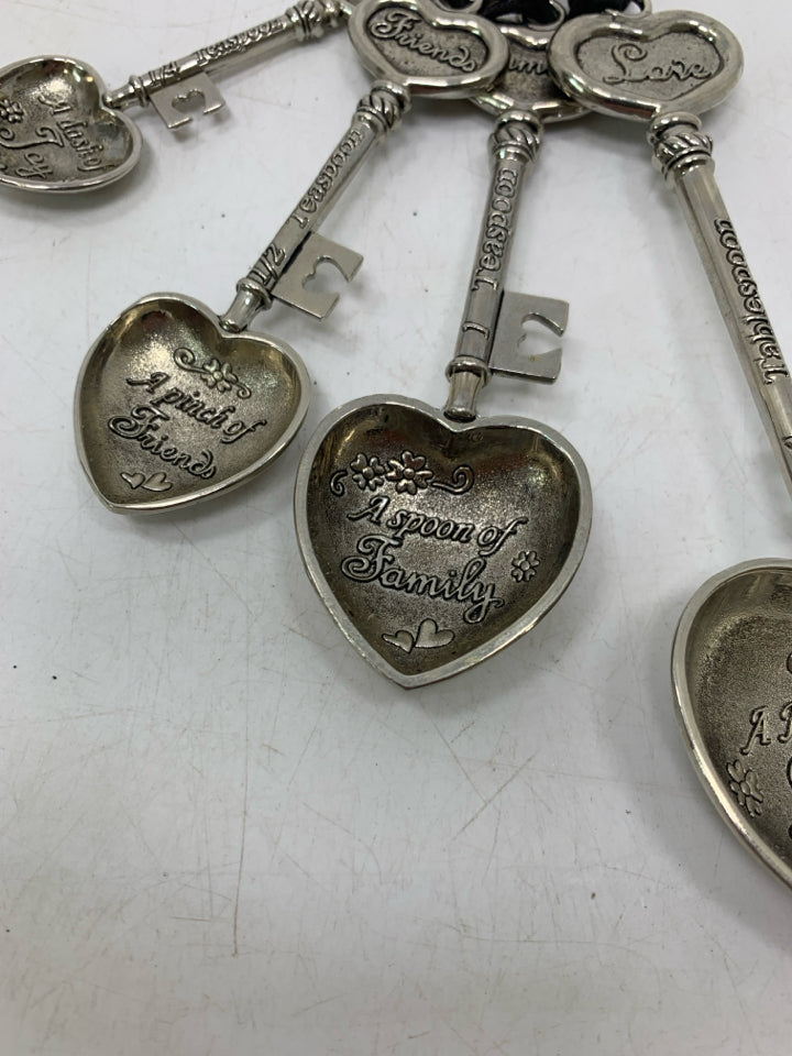 4 VTG METAL HEART SHAPED TEASPOONS.