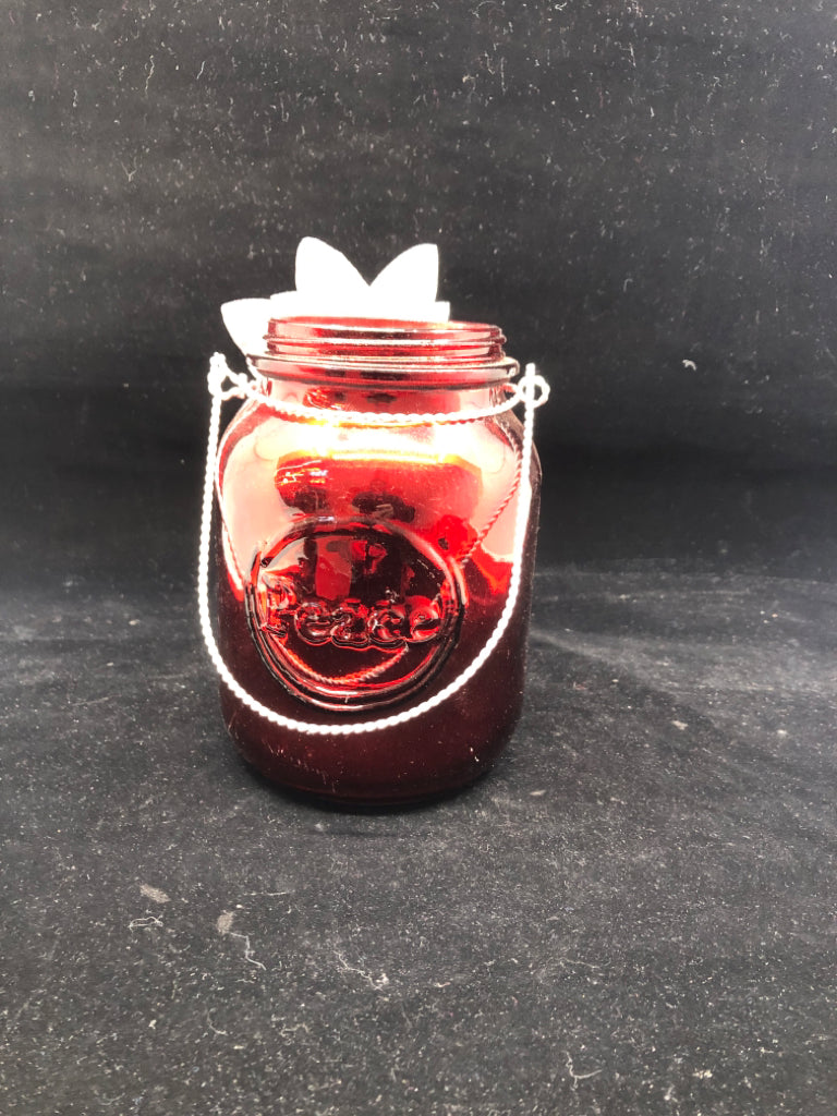 METALLIC RED MASON JAR WITH FLOWER.