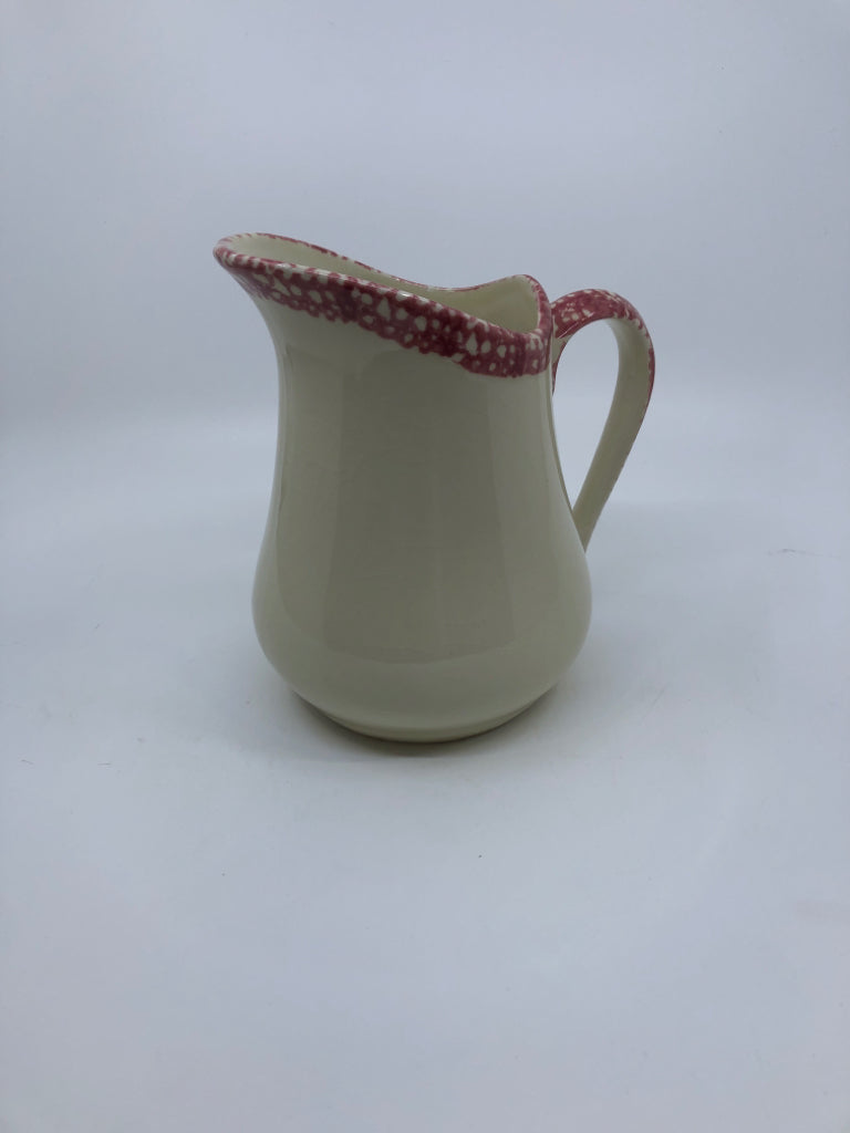 SMALL CREAM PITCHER W RED SPONGED RIM AND HANDLE.