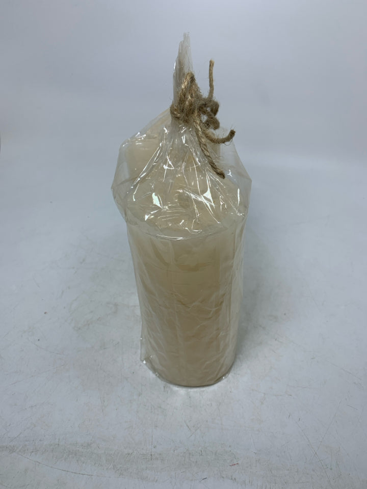 NIP 2 CREAM COLORED PILLAR CANDLES.