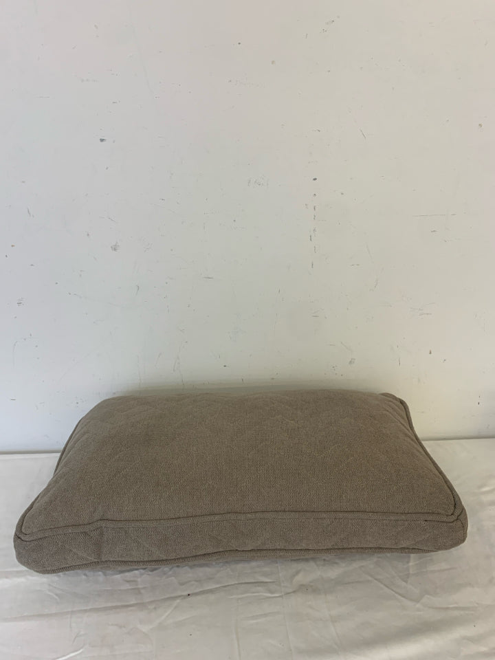 RECTANGLE DARK TAN PILLOW W/ ZIG ZAG STITCHING.