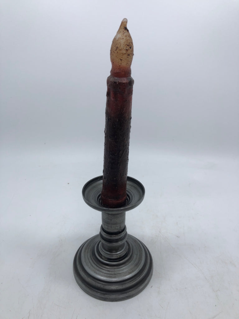2 PEWTER COLORED TAPERED CANDLE HOLDER W/ PRIMITIVE STYLE CANDLES.