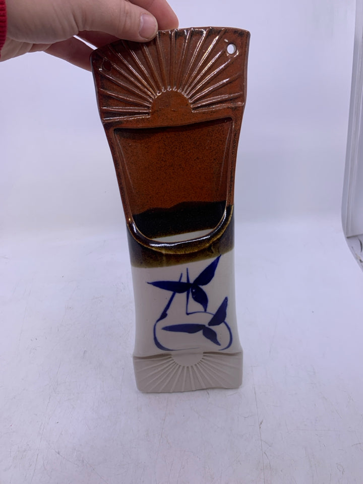 WALL POCKET BROWN TOP WHITE BOTTOM W/ BLUE FLOWERS.