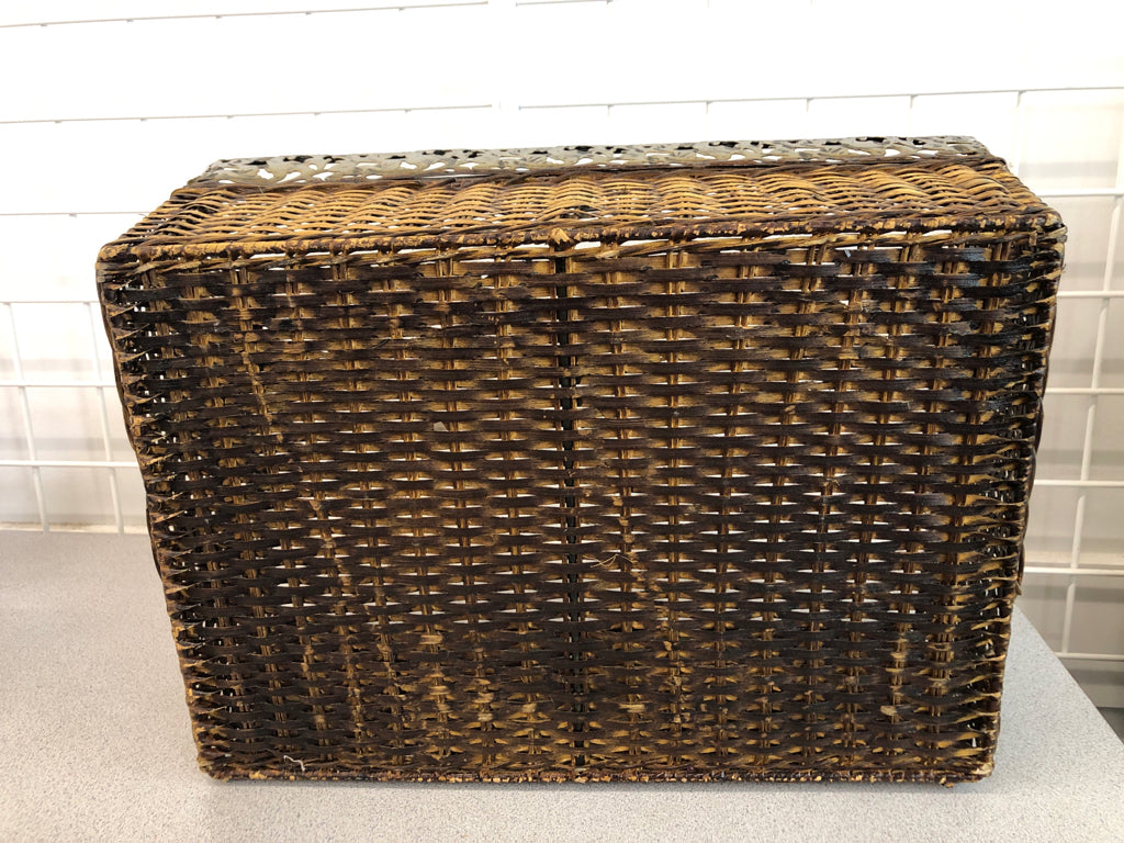 BROWN WOVEN BASKET W/METAL FLORAL RIM AND HANDLES.