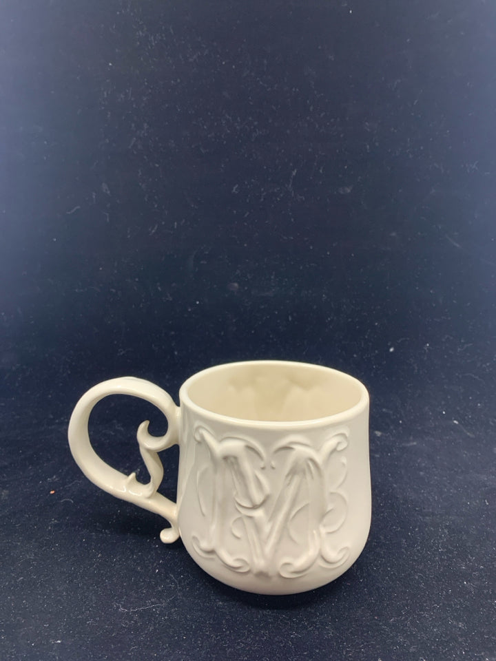 CREAM W/ FANCY HANDLE "M" MUG.