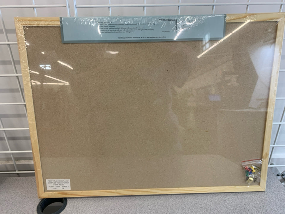 NIP FRAMED CORKBOARD.